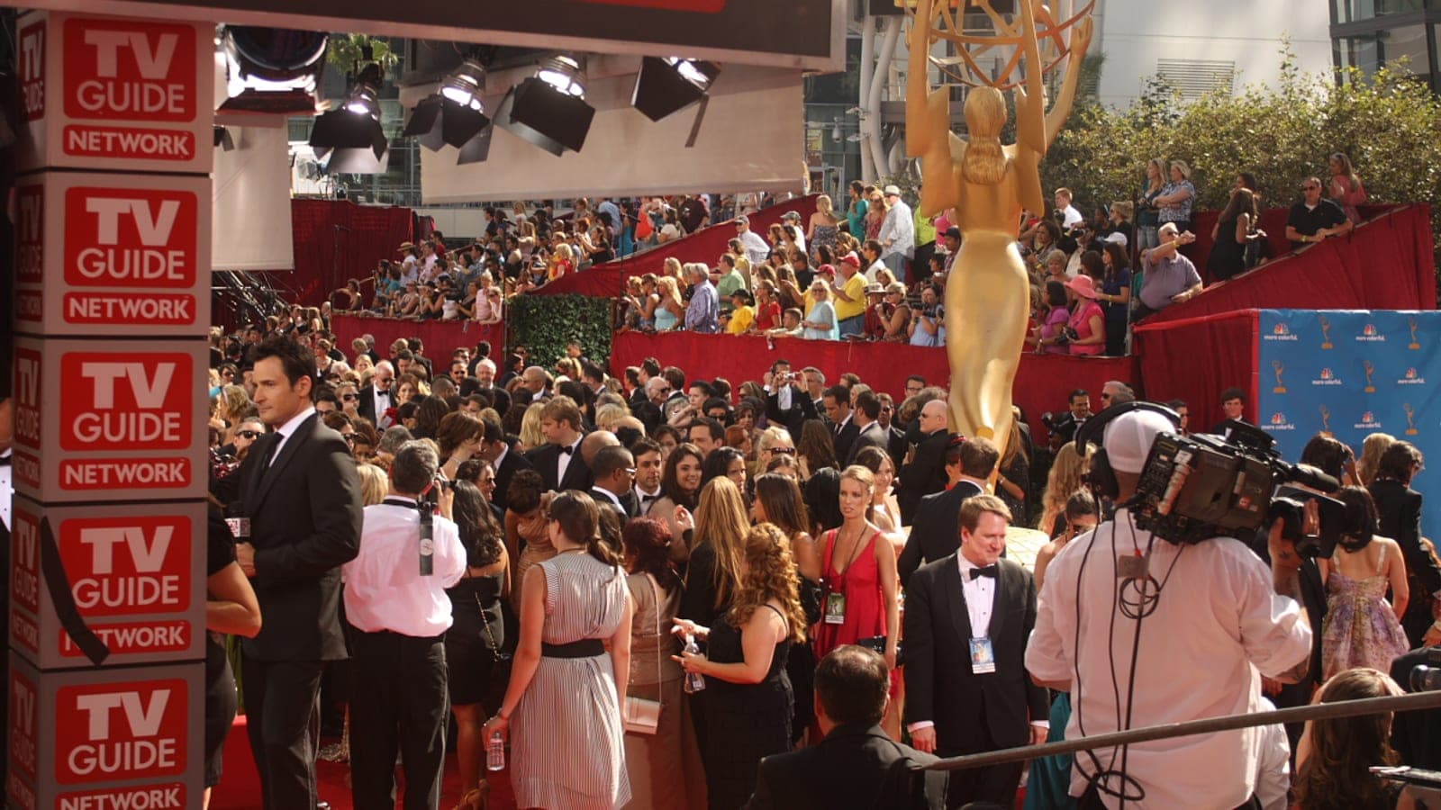 The golden Emmy statue towers over the red carpet crowd arriving at the 2010 Primetime Emmy Awards in Los Angeles.