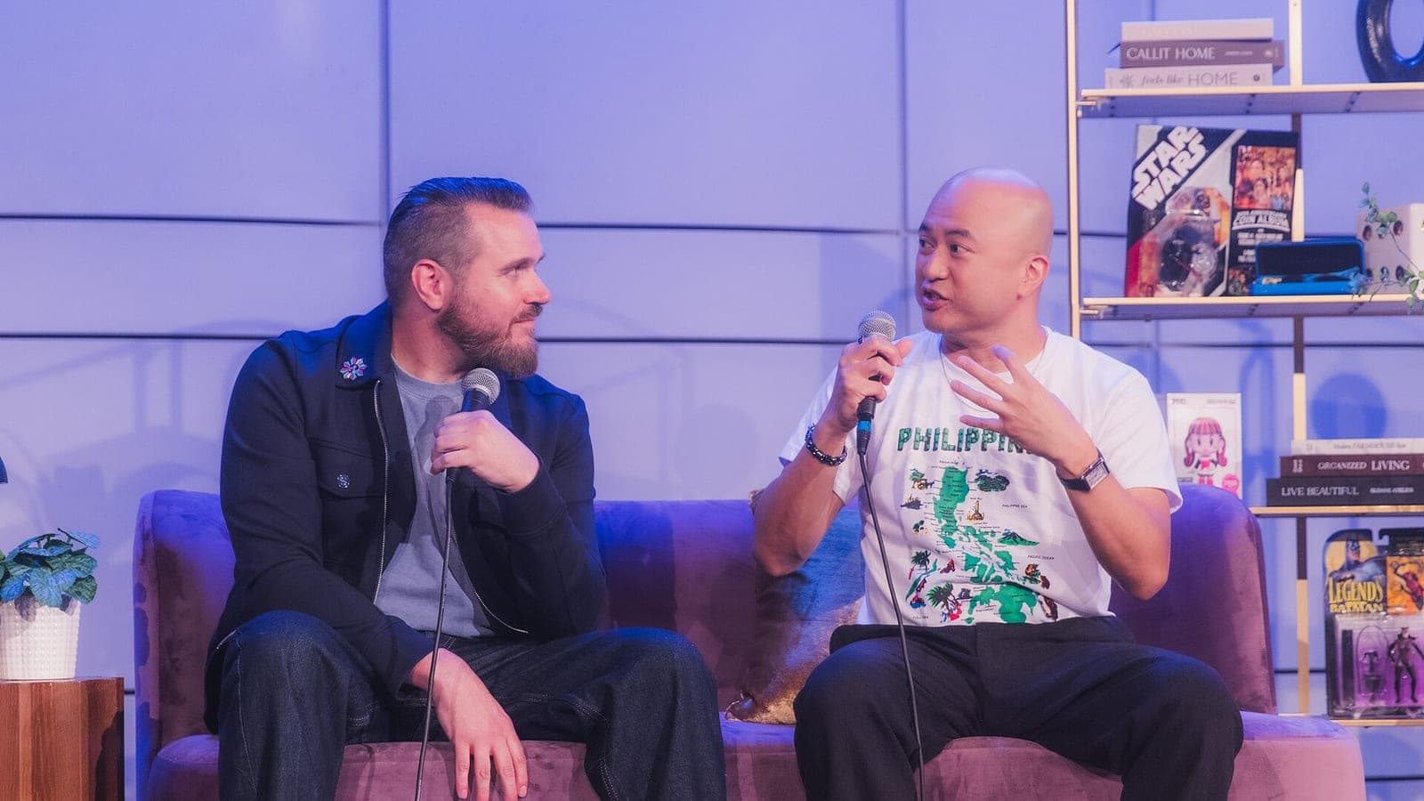 Joel Crawford and Januel Mercado talking on stage with microphones at MultiCon in 2026.
