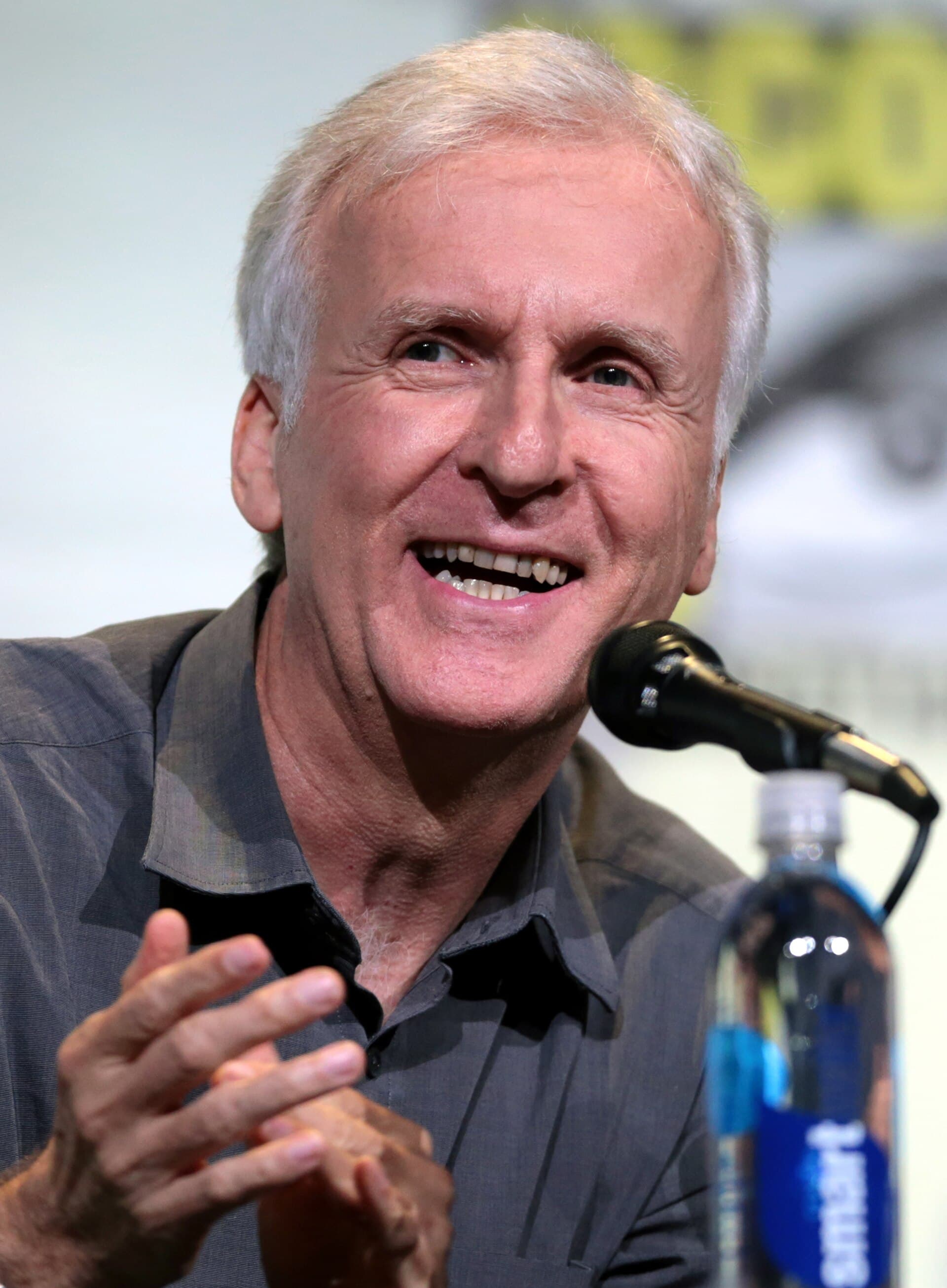 James Cameron speaking into a microphone at San Diego Comic-Con International in July 2016.
